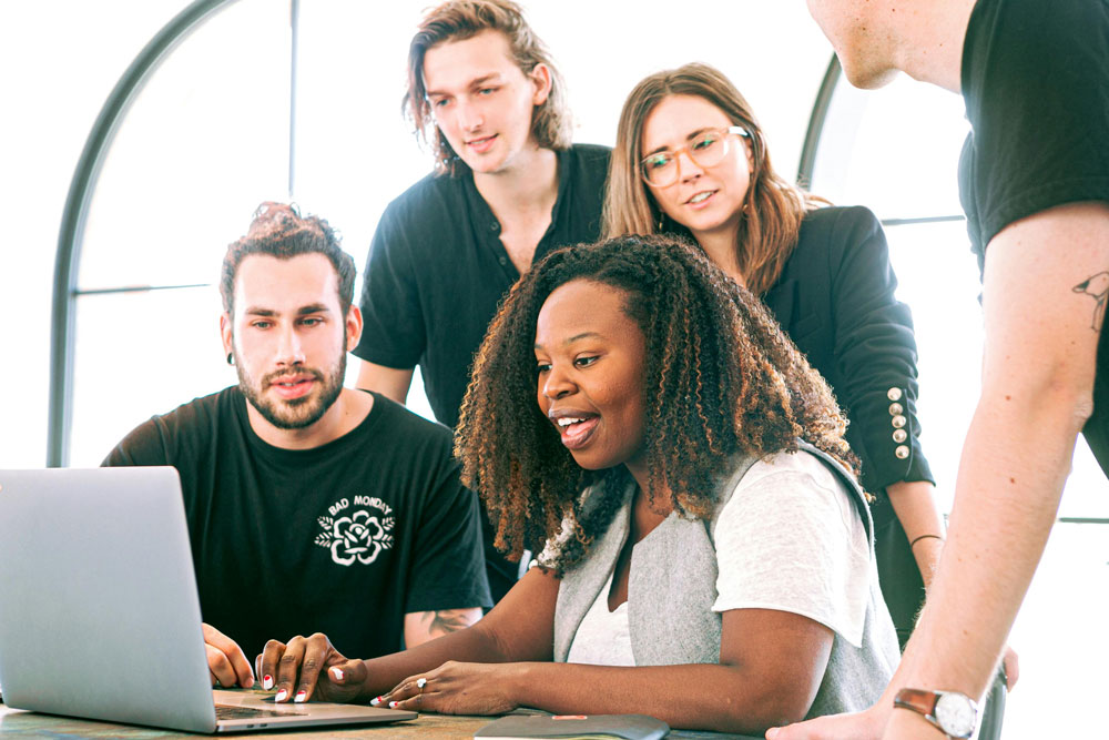 Students viewing a laptop